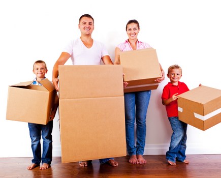 Professional team handling furniture pick-up in Putney storage unit
