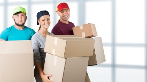 Professional removalists packing a house